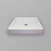 White Acritec regular profile single threshold shower base with center drain in a standard alcove shower setup