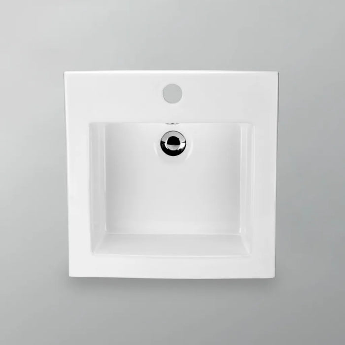 White rectangular Acritec drop-in ceramic basin with sloped sides installed on a modern vanity countertop