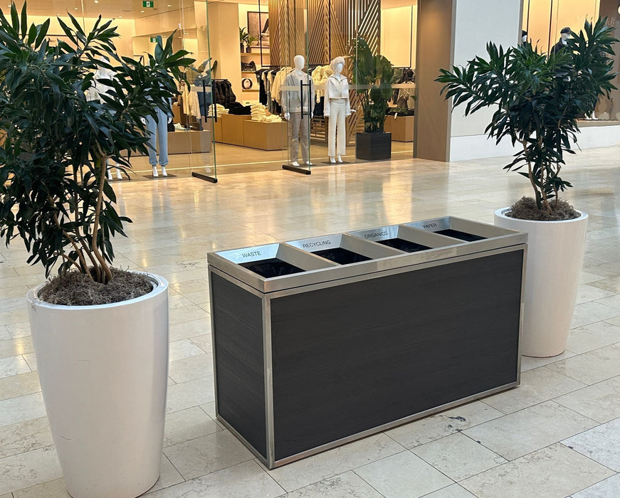 Front view of Denali laminate triple-stream station with tilt-up lids