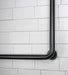 Durable stainless steel L-shaped grab bar with snap on flanges in matte black