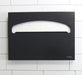 Frost 199-BLK matte black toilet seat cover dispenser close-up in use