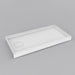 White Acritec covered drain single threshold shower base with end drain and recessed cap in a modern low profile installation